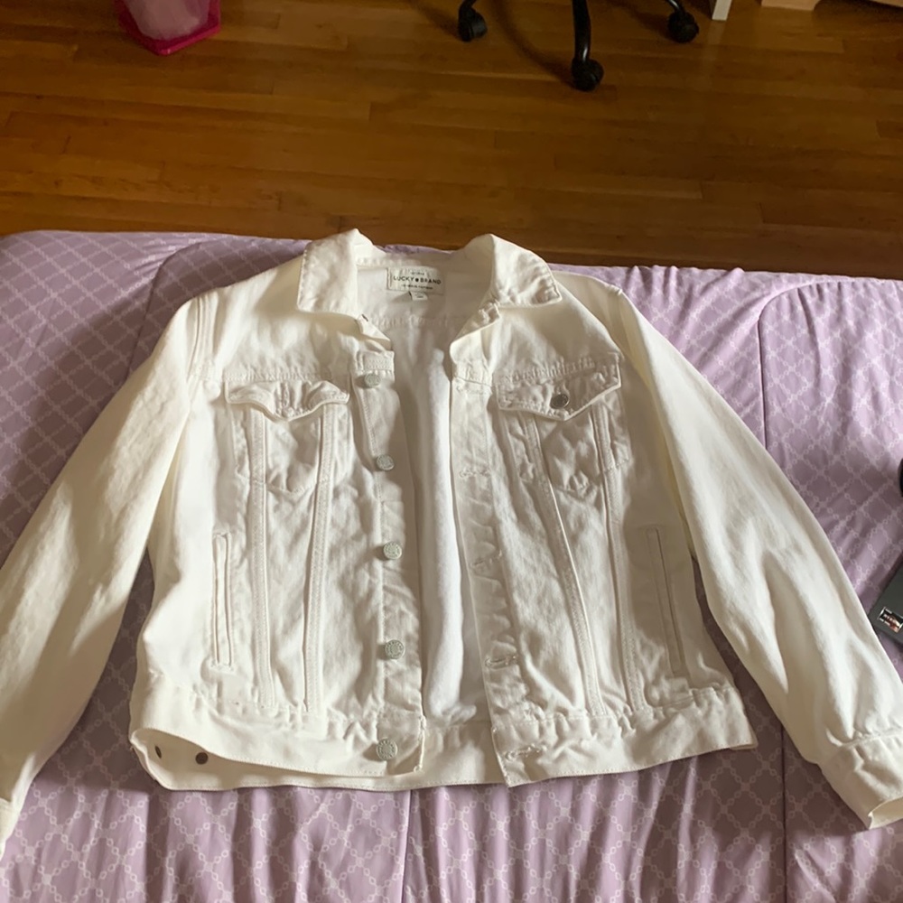 White jean jacket. Previously worn, good condition. No rips or stains.